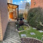 Réaménagement d'un micro jardin à Herstal. 

Remplacement des allées et terrasse en bois par du ...